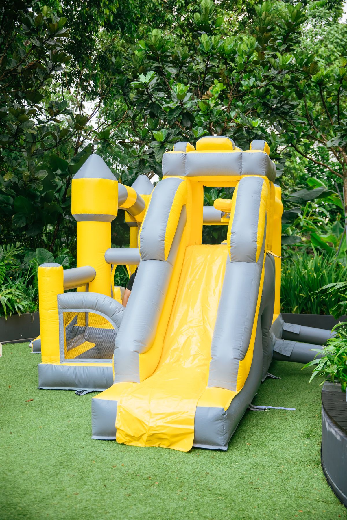 Yellow bouncy castle with a slide