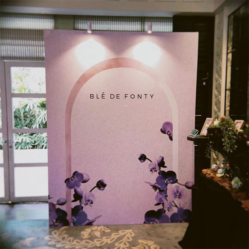 Lilac arch backdrop for a brand event