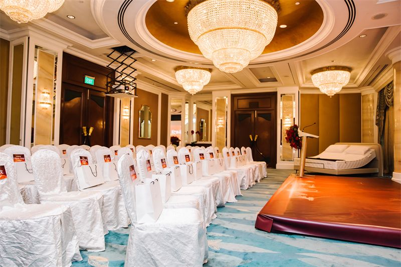 Ballroom set up with rows of white chairs