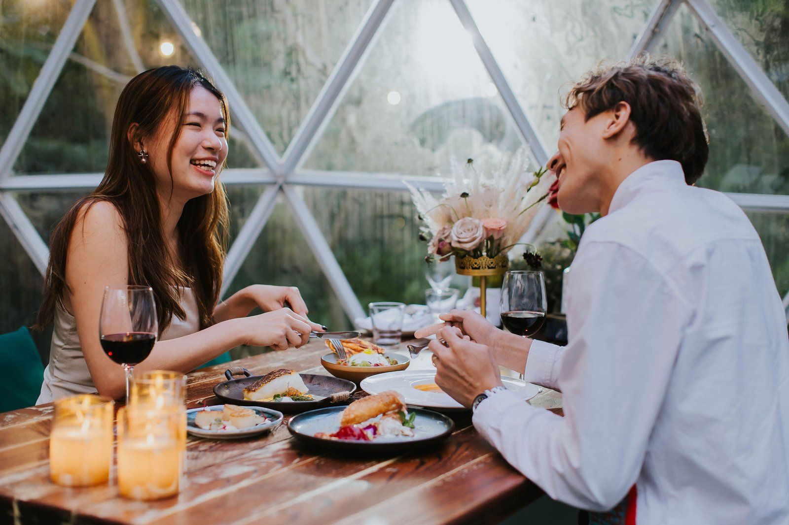 Couple dining inside a garden dome
