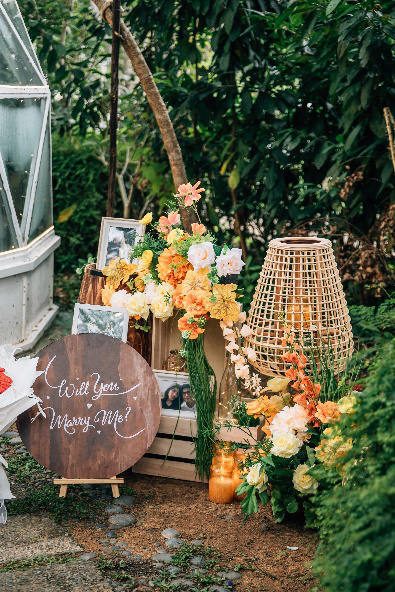 Marry Me sign among flowers