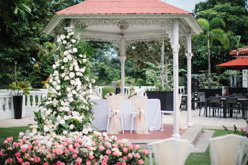 White gazebo with a floral tree